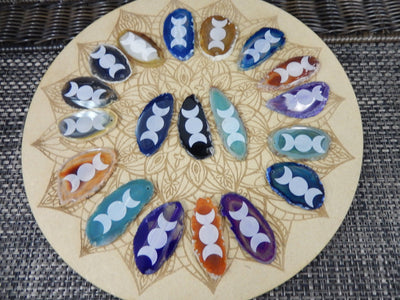 This picture is showing all the variety of colors we have available for our agate slice with large moon design. 