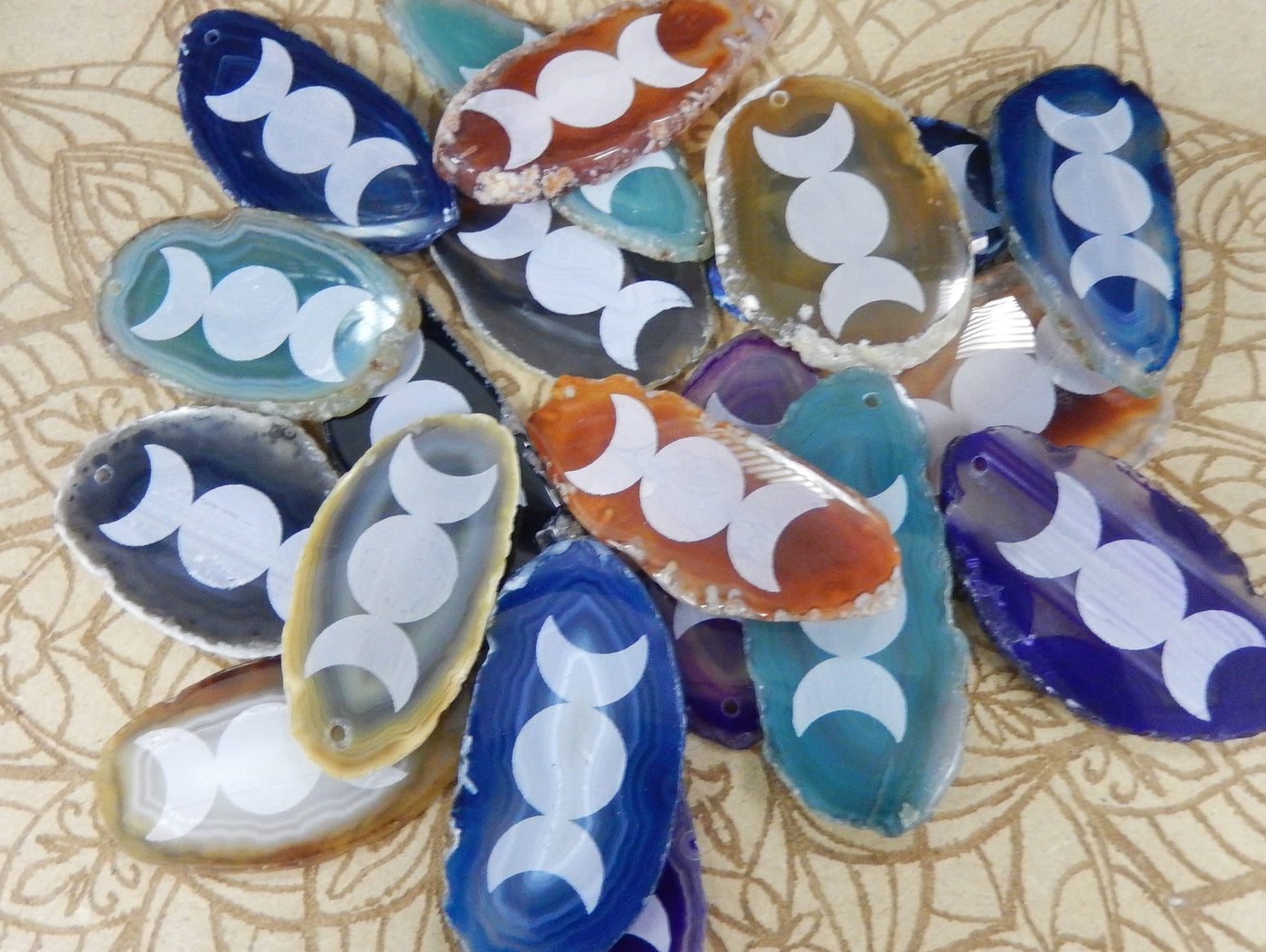 This picture is showing all the variety of colors we have available for our agate slice with large moon design.