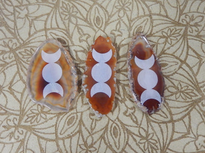 Picture of 3 of our red/orange agate slice with large moon phase.