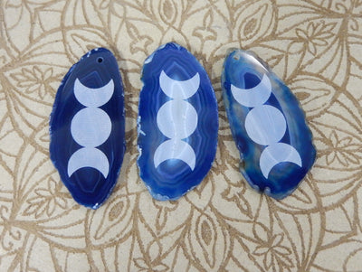 Picture of 3 of our blue agate slice with large moon phase.