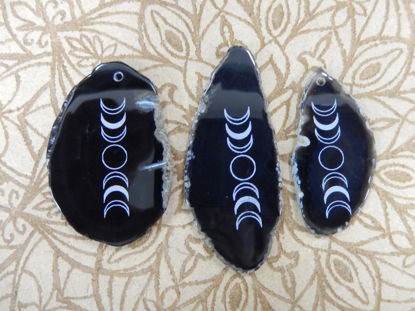 Picture of 3 of our black agate slices.
