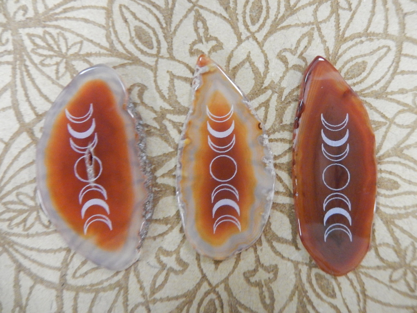 Picture of 3 of our red/ orange agate slices.