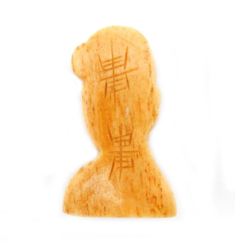 back picture of carved bone woman top to bottom drilled.