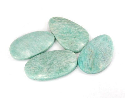 Picture of four of our amazonite bead top side drilled on a white background.