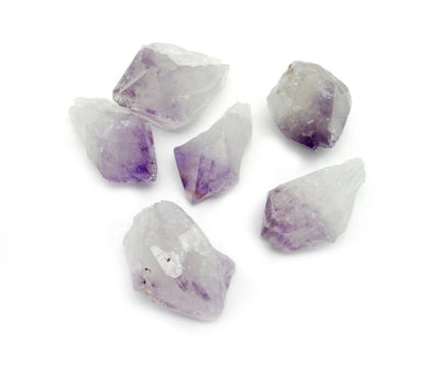 6 amethyst points displayed on a white background.