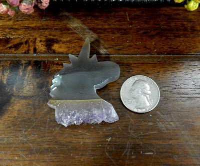 Amethyst Stalactite Unicorn Shaped Cabochon next to quarter for size reference