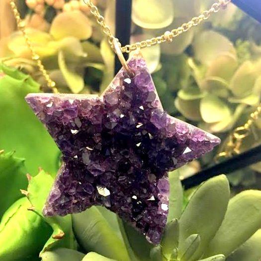 amethyst star bead displayed on a necklace chain 