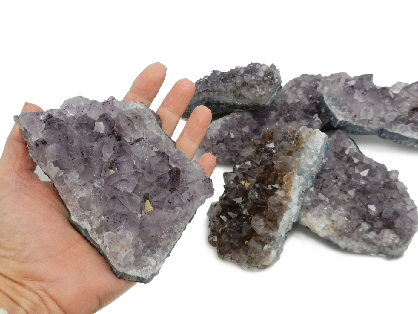 amethyst cluster in hand for size reference 