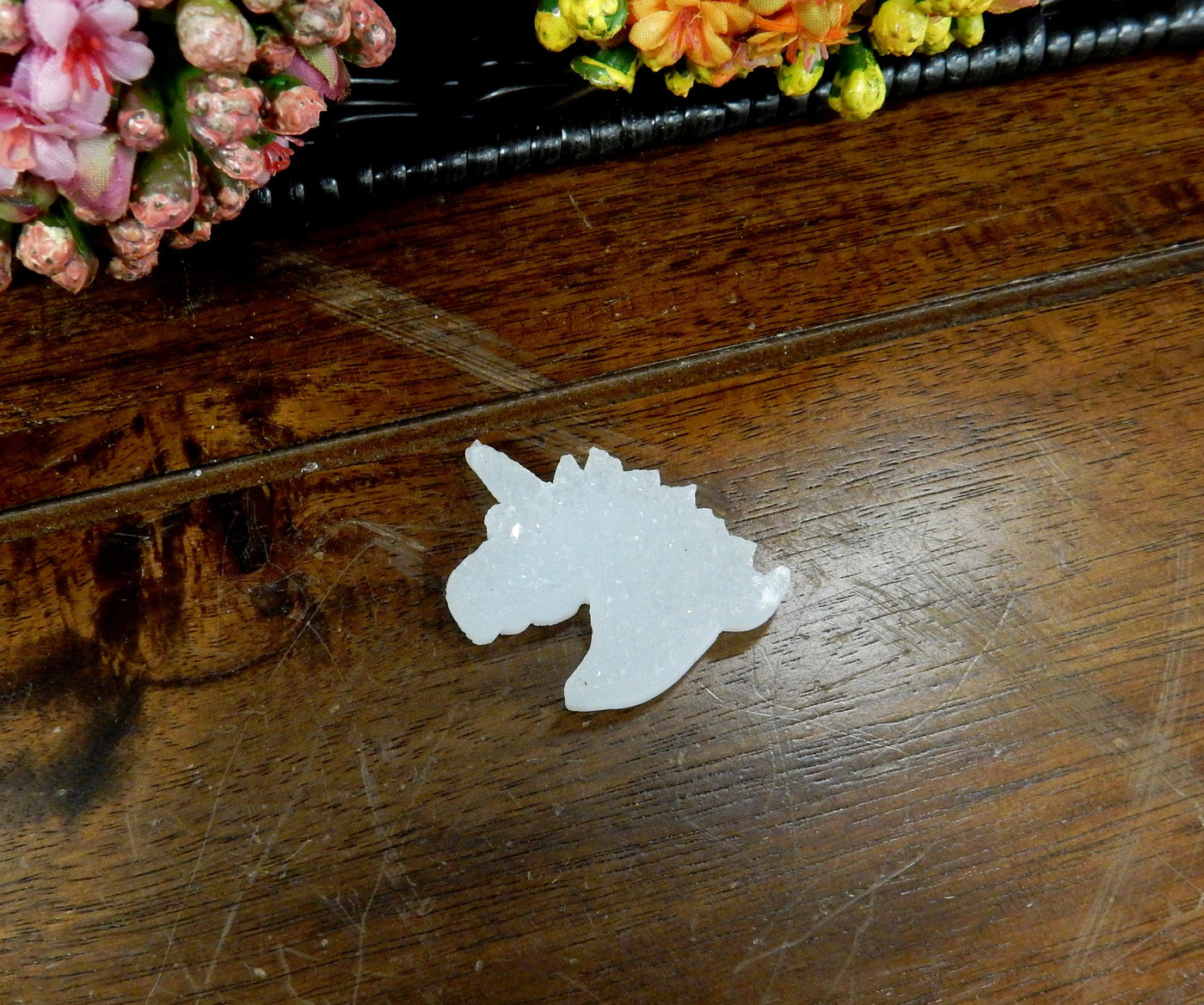 Natural Druzy Unicorn Shaped Cabochon Top Drilled Bead  - one on a table