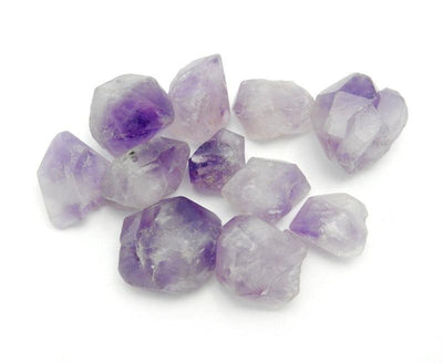 pile of Amethyst Point Top Side Drilled Beads on white background
