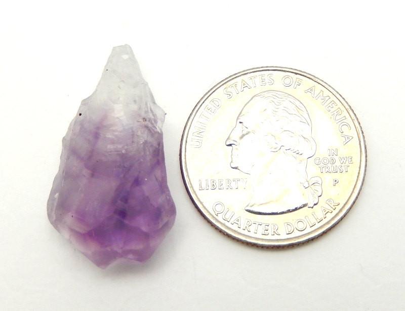 Amethyst Point pictured next to a quarter for size reference