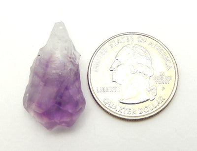 Amethyst Point pictured next to a quarter for size reference