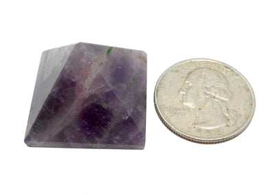 1 Amethyst Pyramid next to a quarter for size
