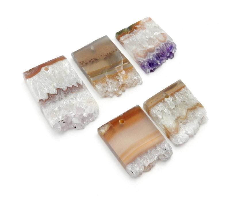 angled shot of amethyst slice drilled beads on white background