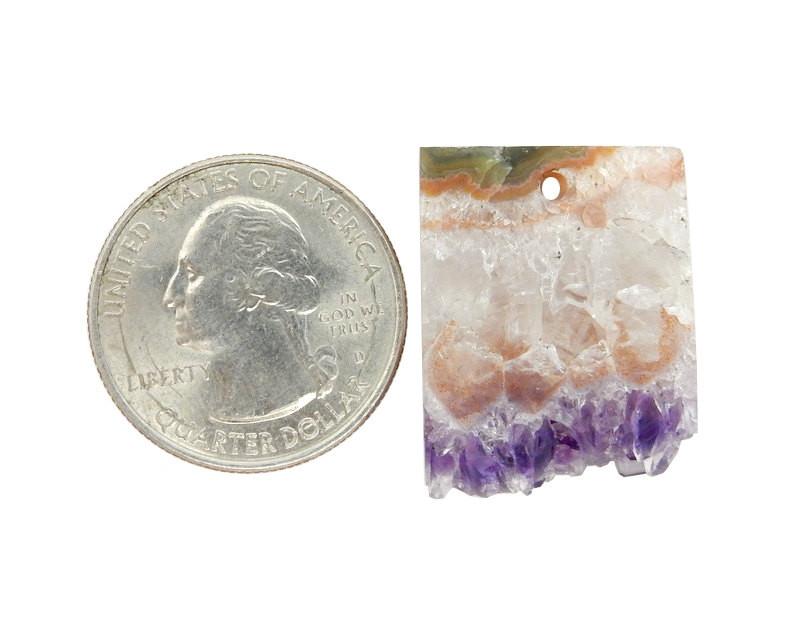 amethyst slice drilled bead next to a quarter for size reference