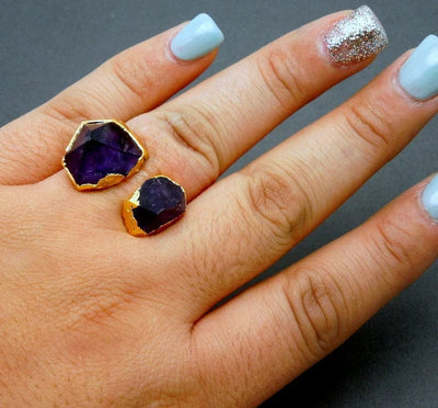 Amethyst double point adjustable gold plated ring on woman's hand.