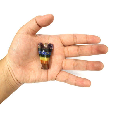 one 7 Chakra Stone Crystal Angel Figurine in a hand for size