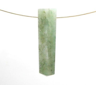 aquamarine drilled bead hanging on a wire on white background