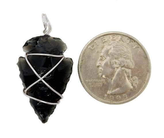 Black Obsidian Arrowhead Silver Tone Wire Wrapped - arrowhead with quarter on the side to show size reference 