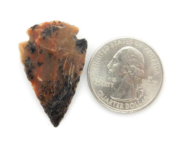 Jasper Arrow Heads 1"  size next to a quarter for size reference