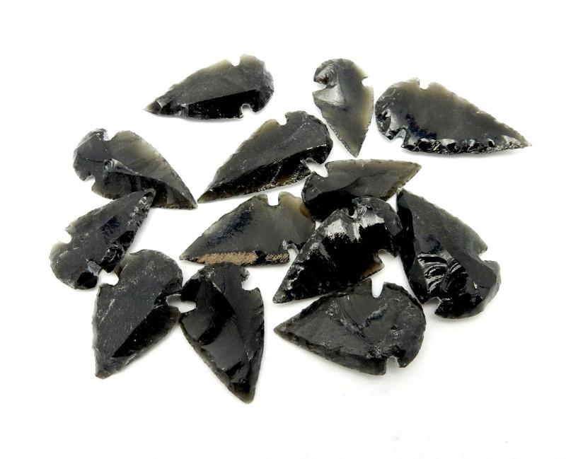back obsidian arrowheads on white background