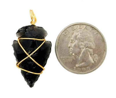 Black Obsidian Arrowhead Wire Wrapped Gold Tone displayed next to quarter for size reference