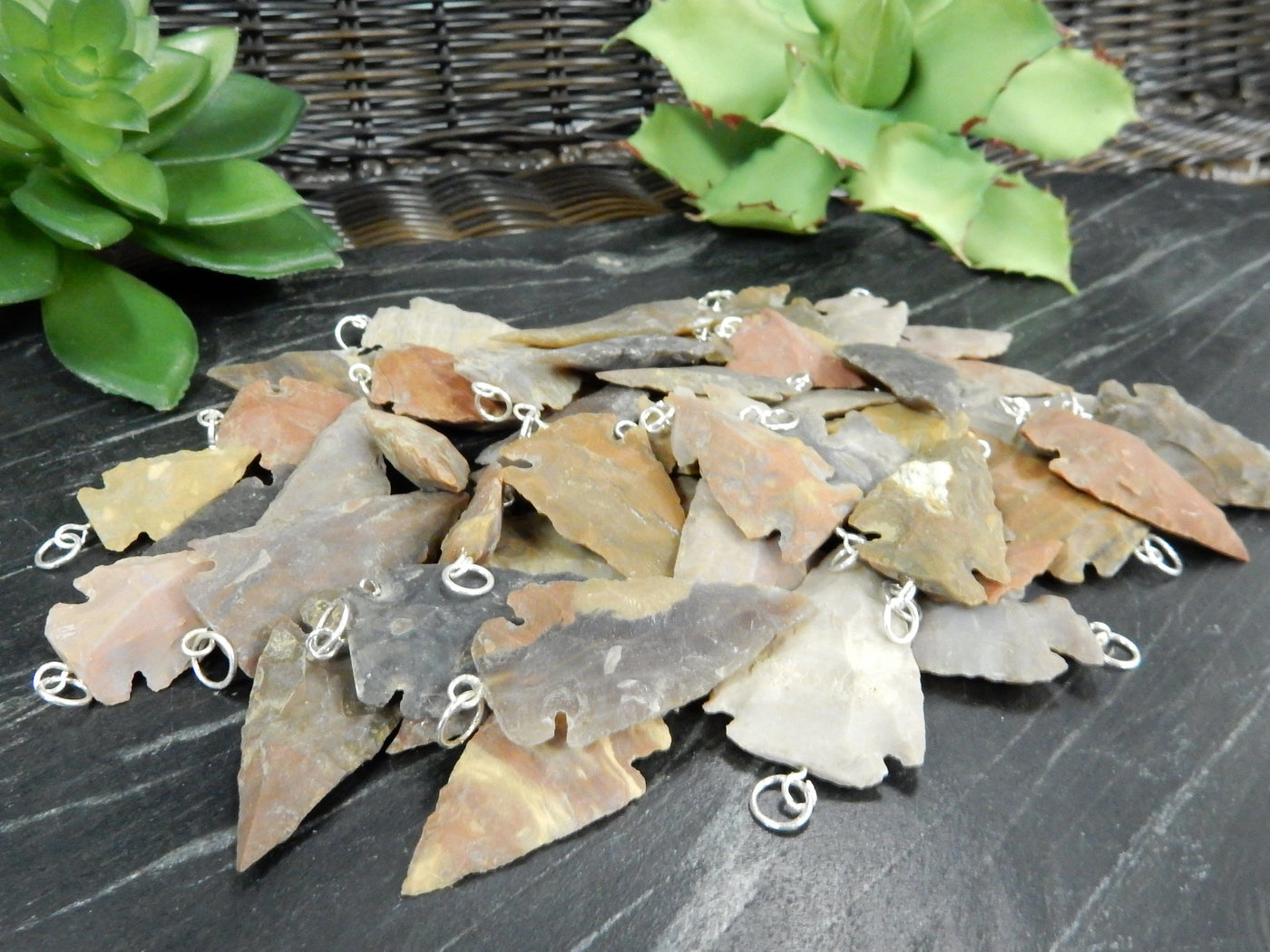 angled shot of pile of pendants with decorations in the background