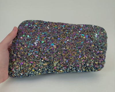 video that shows off the shine of the rainbow titanium druzy stone 