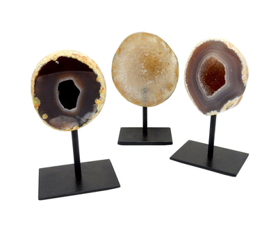 Three Agate Druzy Geode on Metal Base with a white background showing color and pattern variation. 