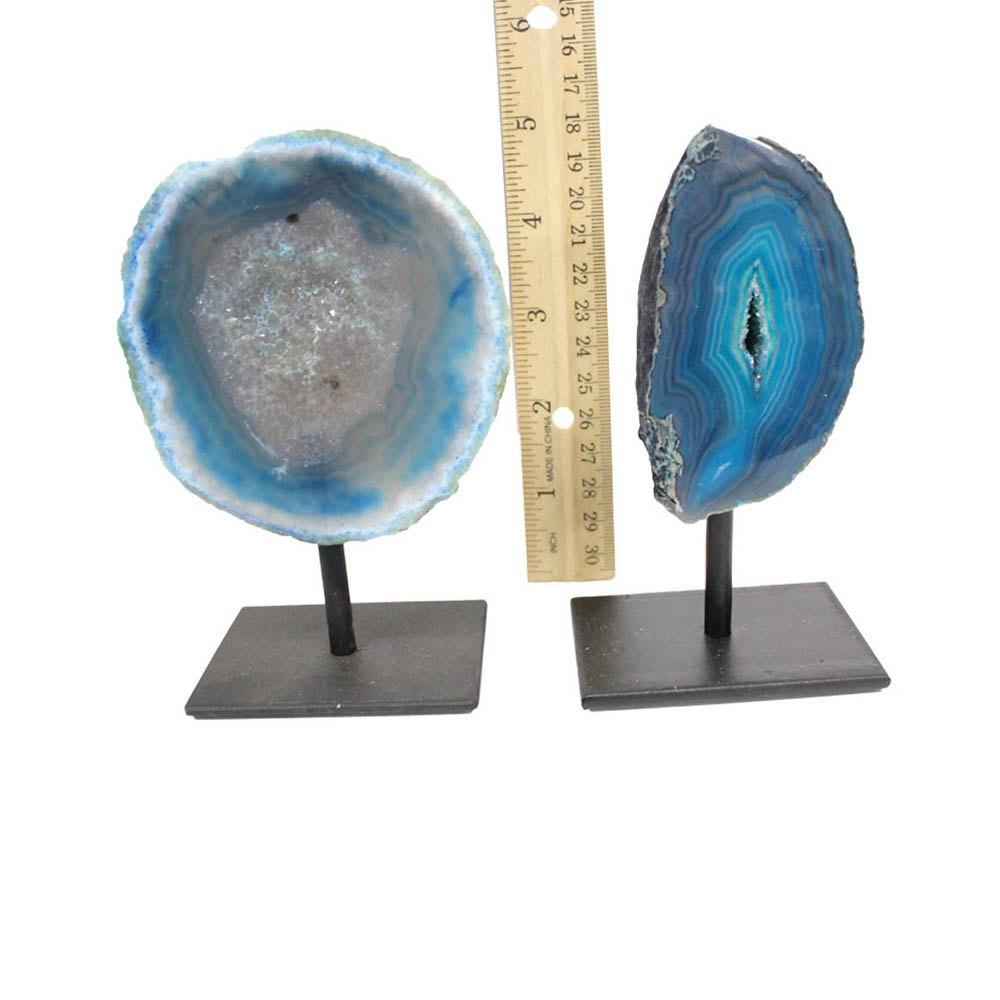 Two agate geode on a metal base displayed next to a ruler for size reference. Product is displayed with a white background.