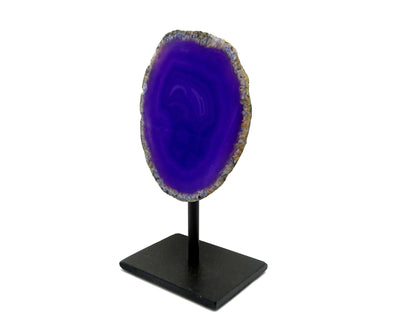 One agate geode on metal base with a white background.