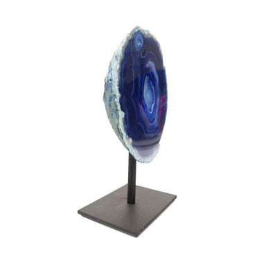 angled shot of blue agate geode metal base on white background