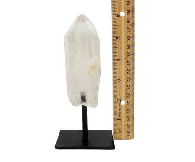 Crystal Quartz Point in Metal Base next to a ruler for size reference