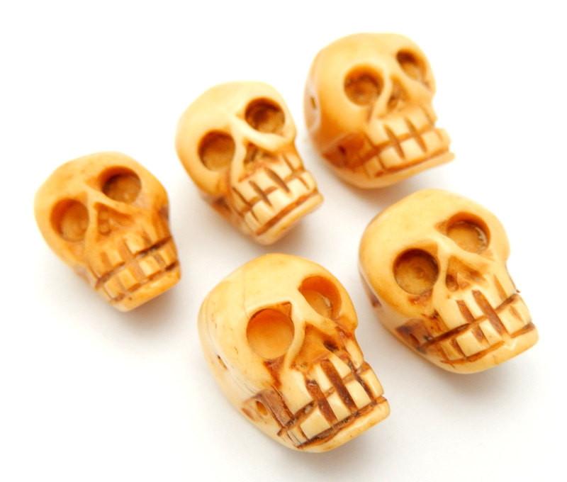 side view of bone skull bead for thickness reference