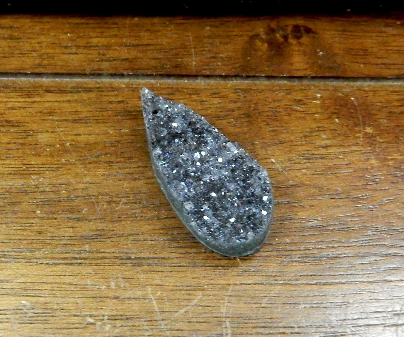 Druzy Teardrop Top Center Drilled Bead shown from side view to reference thickness
