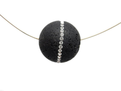 Single Petite Round Lava Rock Bead With CZ Rhinestone Accent Band with string through drilled hole in a white background