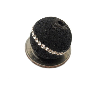 Petite Round Lava Rock Bead With CZ Rhinestone Accent Band on top of a quarter for size comparison