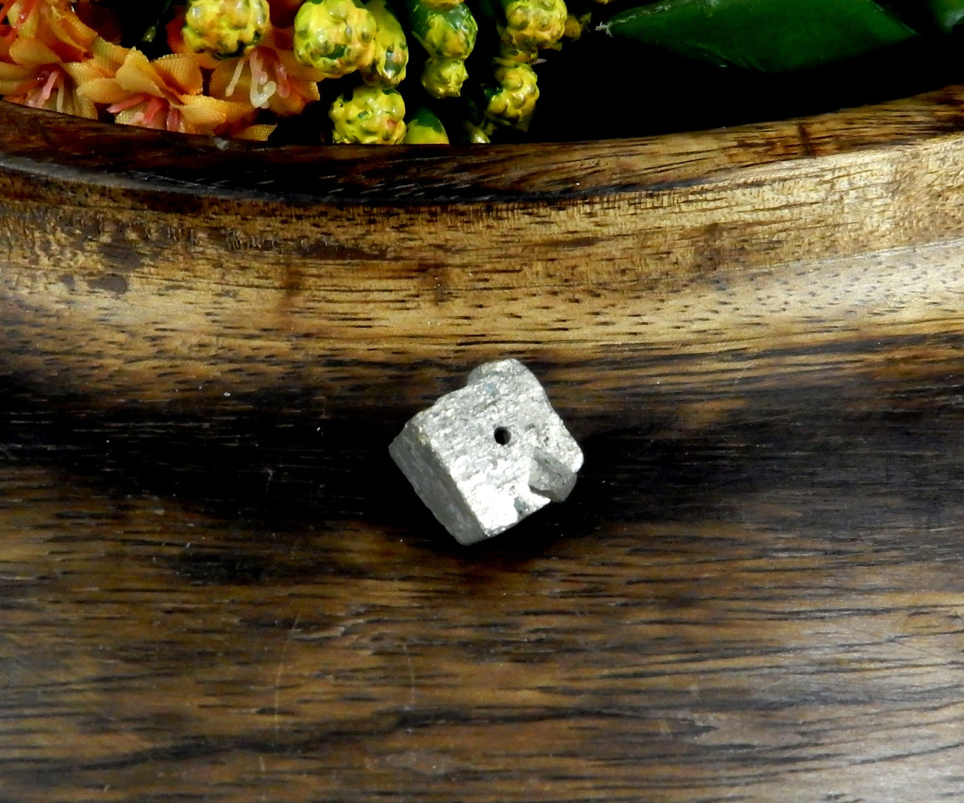 up close shot of Pyrite Cube Side Drilled Bead on wooden background