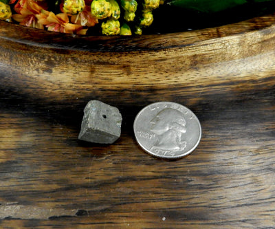 Pyrite Cube Side Drilled Bead next to a quarter for size reference
