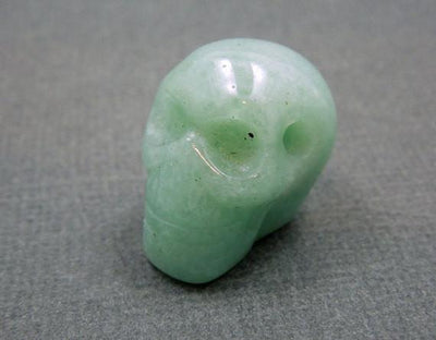 close up of one aventurine skull bead for details