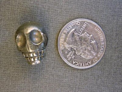 one hematite skull bead with quarter for size reference
