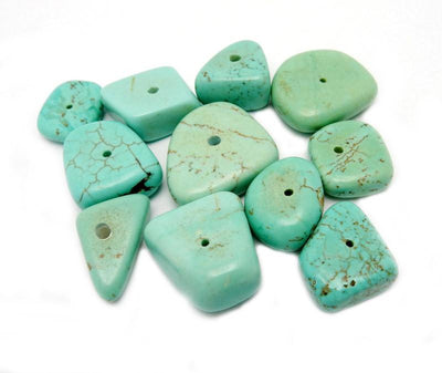 10pcs of Turquoise Howlite Beads displayed to show the differences in the shapes 