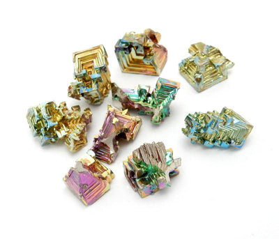 multiple bismuth crystals showing different sizes and colors 
