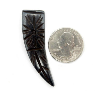 Quarter comparing size to the Black Bone Horn bead