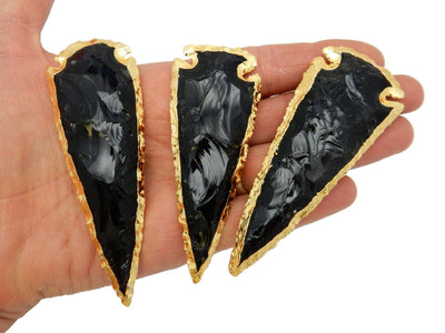3 Black Obsidian Arrowhead Electroplated Gold edges in hand for size reference