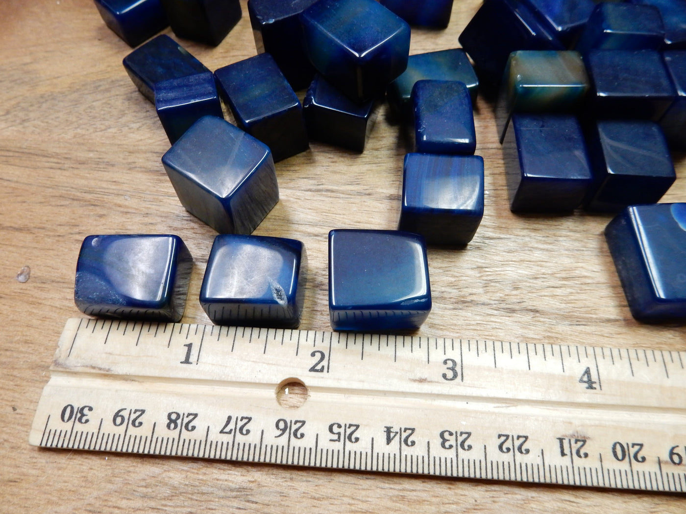 blue agate cubes next to a ruler