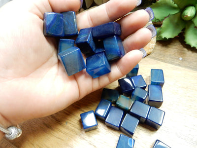 blue agate cubes in a hand