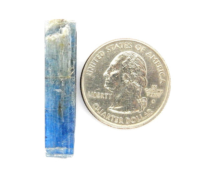 blue kyanite next to a quarter