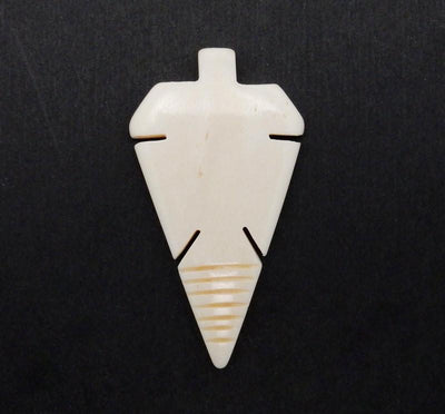 Carved Bone Arrowhead Top Side Drilled Bead  on black background