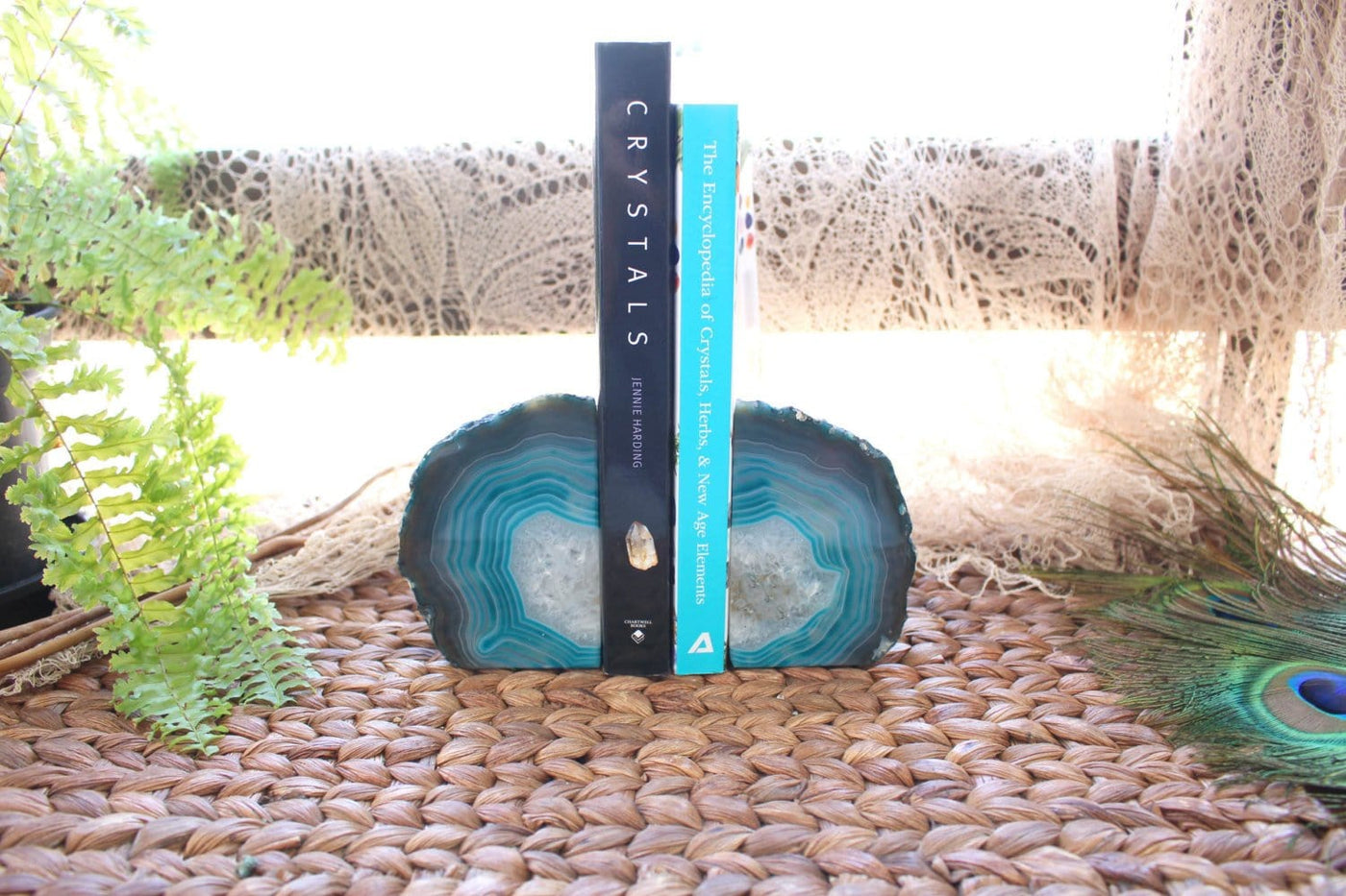 Teal Agate Bookend Pair shown holding books in an alter. 